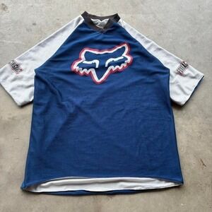 Fox Racing blue and white motor jersey flaws throughout with sleeve hits